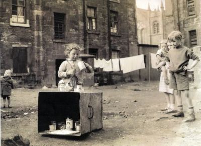 Children happily playing in the back courts of a Glasgow Tenement 1960s
