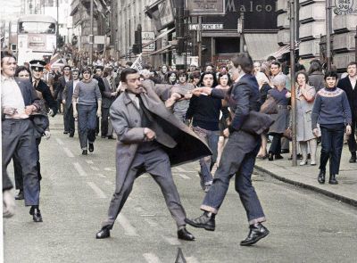 Colourised Photo Of Special Branch Detective Inspector George Johnstone with fag in mouth, being attacked by a youth with an open razor in Renfield Street, Glasgow
