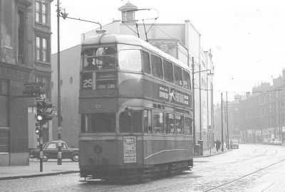 Tram on Maryhill Road Glasgow passing The Olde Tramway Vaults
