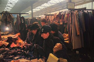 Women shopping for clothes at an indoor market in Glasgow, March 1939
