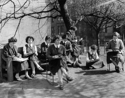 Young girls, sitting outside sketching in Glasgow’s West- End, Laurel Bank.
