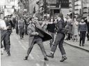 Detective_Inspector_George_Johnstone_being_attacked_by_a_youth_with_an_open_razor_in_Renfield_Street2C_Glasgow_1971.jpg