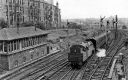 View_of_a_departing_train_on_the_rails_of_Maryhill_Central_Station_Taken_from_Garrioch_Road_Bridge_Glasgow_1963.jpg